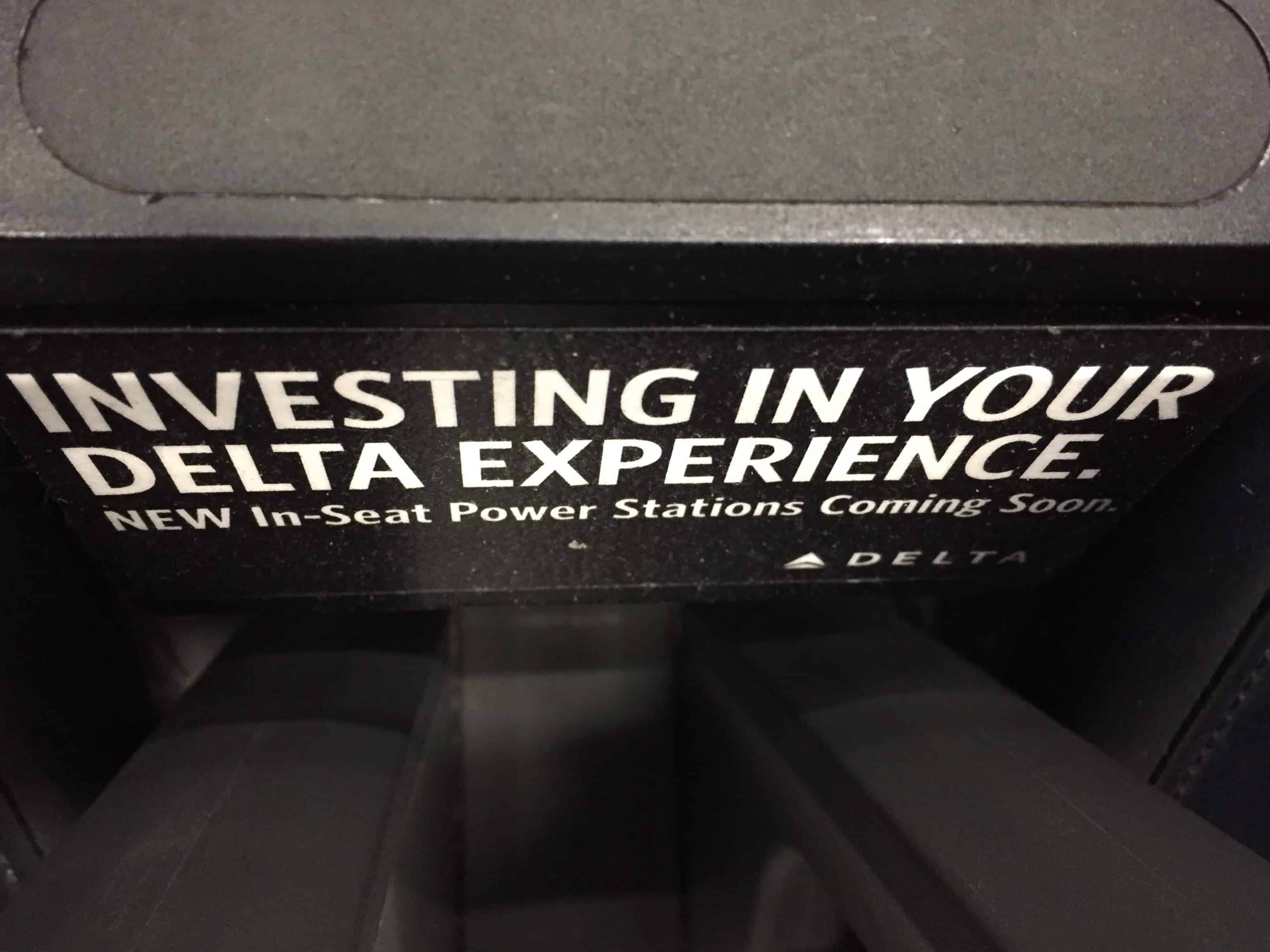 Delta Airlines sign "investing in your Delta experience"