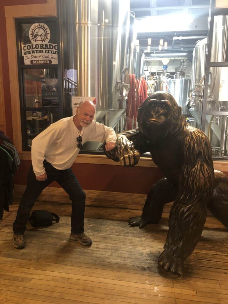 The Places Where We Go visit Wynkoop Brewing Company, Denver Colorado and pose with gorilla statue