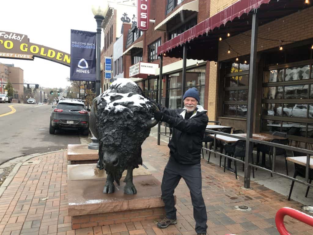 The Places Where We Go visit Downtown Golden Colorado and post with a bison statue