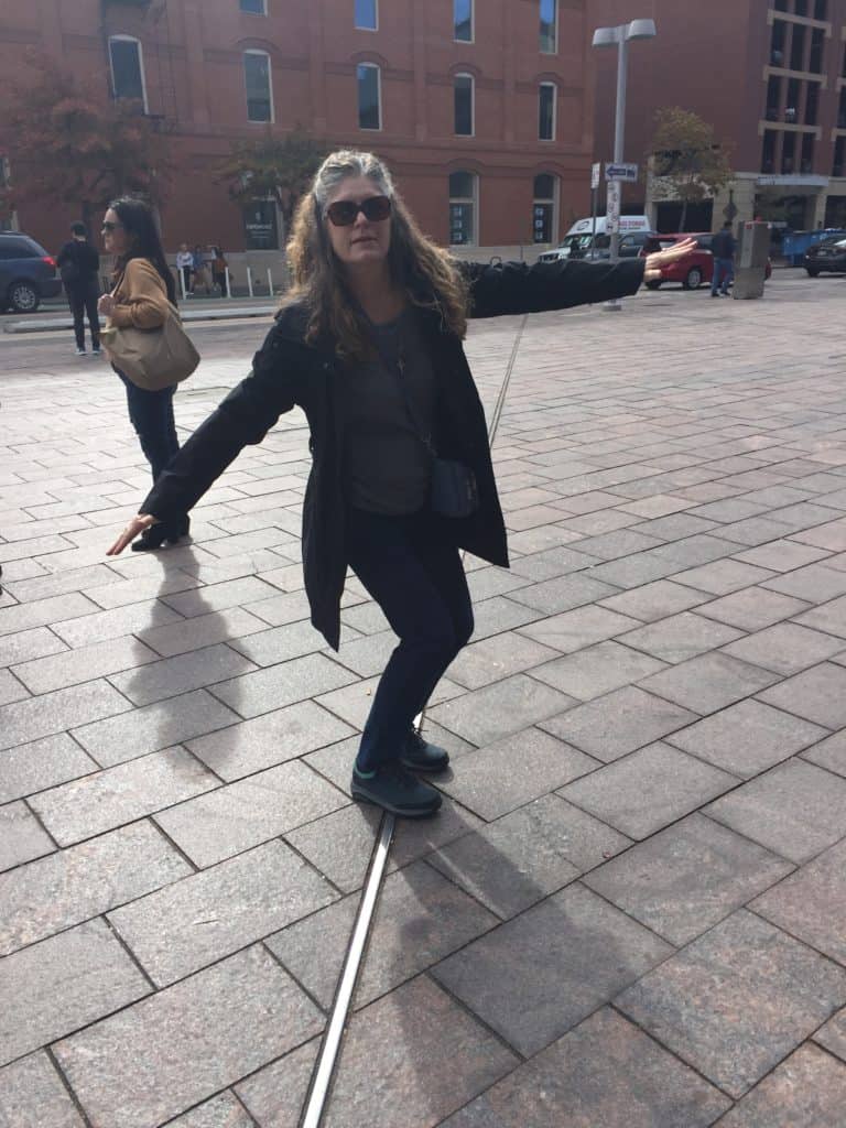 The Places Where We Go stand on the 105th Meridian Line outside of Union Station in Denver, Colorado