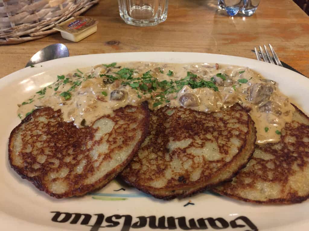 Potato pancakes with forest mushrooms at Kurna Chata in Wroclaw Poland