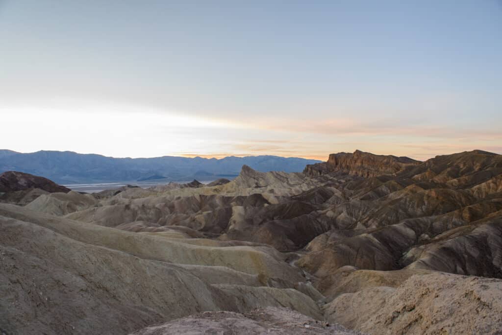 Zabriskie Point at sunset in Death Valley National Park. Photo by https://theplaceswherewego.com/