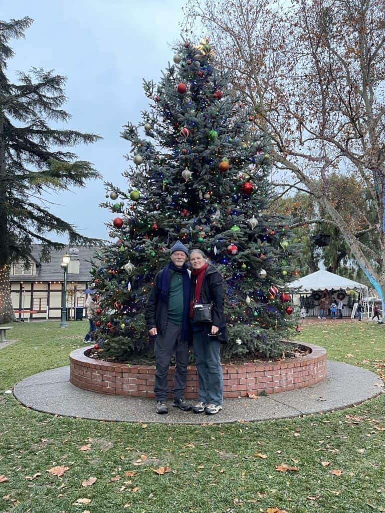 The Places Where We Go in front of a Christmas tree at Solvang's Julefest