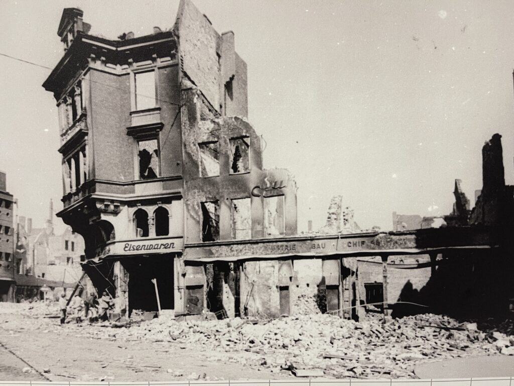 Black and white photograph showing building destruction during WWII - displayed at London RAF Museum