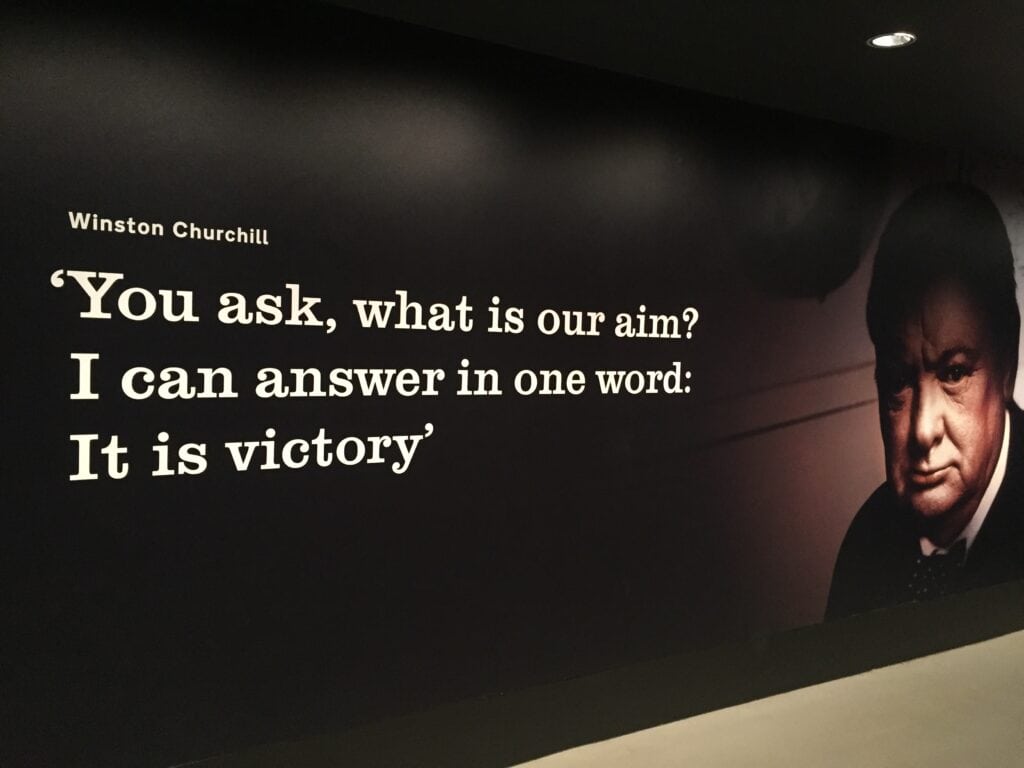 Quote of wall mural at Churchill War Rooms that reads, "You ask, what is our aim? I can answer in one word. It is victory."