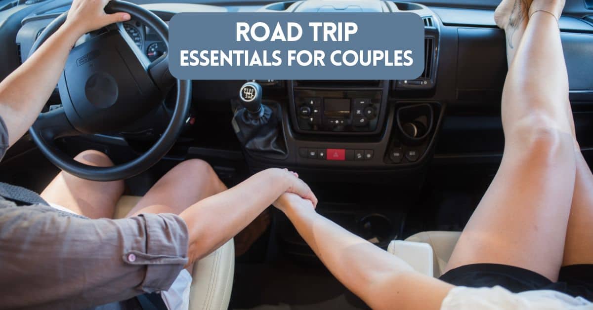 Cover image for article about road trip essentials for couples - showing a couple in a car holding hands