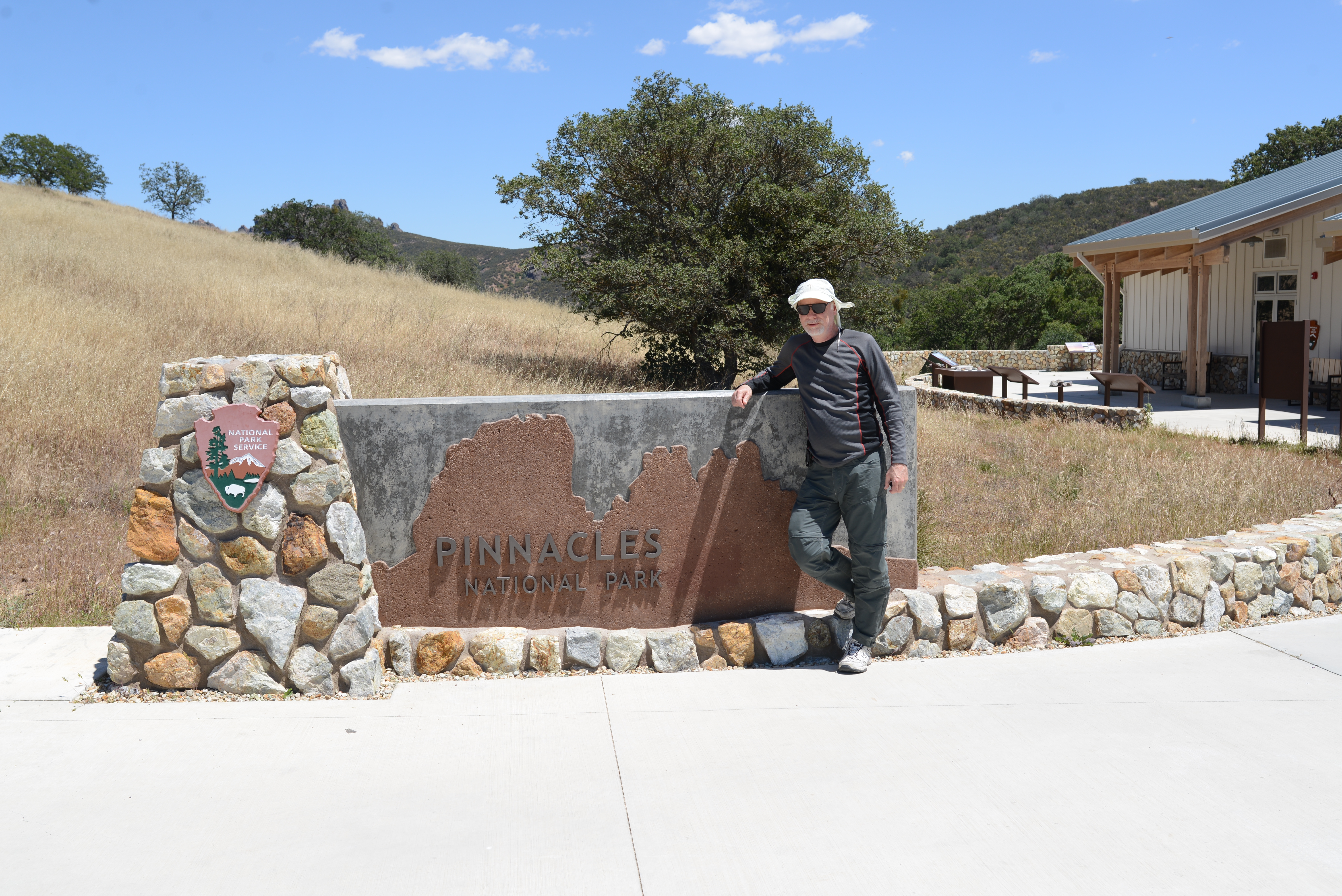 Standing in front of Pinnacles National Park Sign