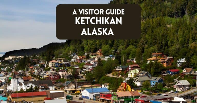 Blog post cover image for visitor guide to Ketchikan Alaska showing a view of homes in the city