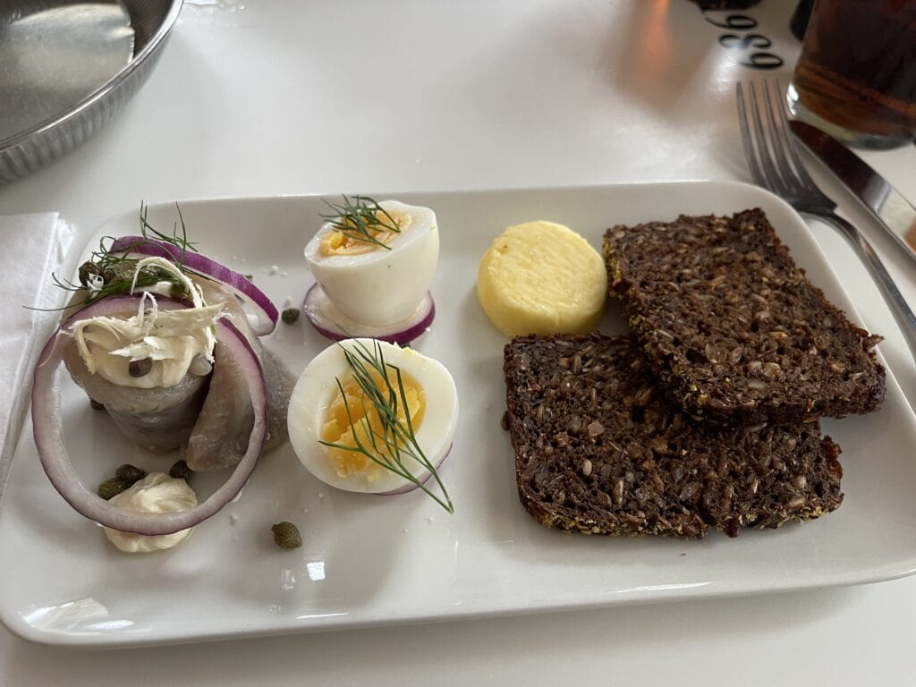 open face sandwich at Europa in Copenhagen and hard boiled egg with herring