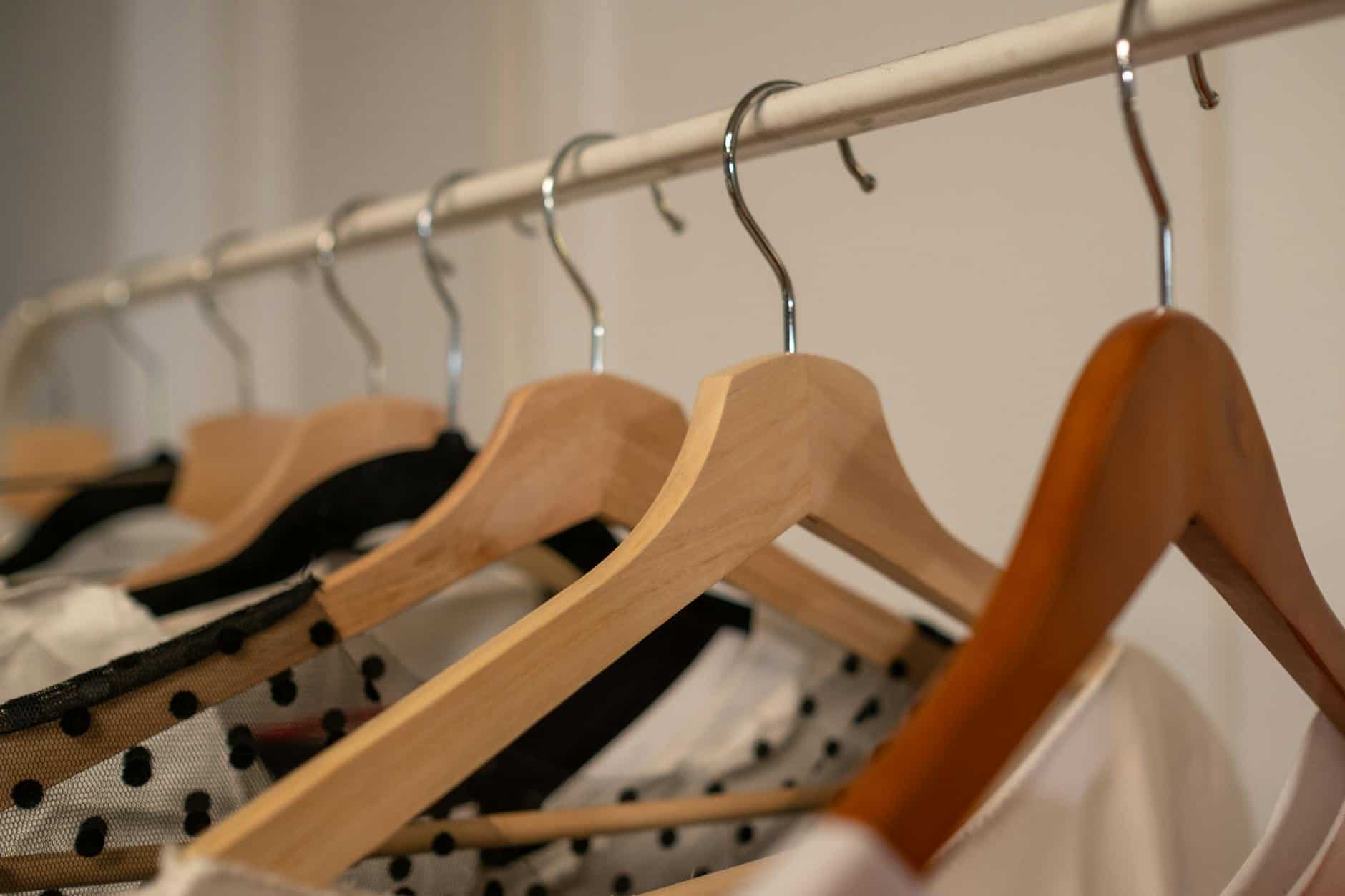 a close up on hangers with clothes