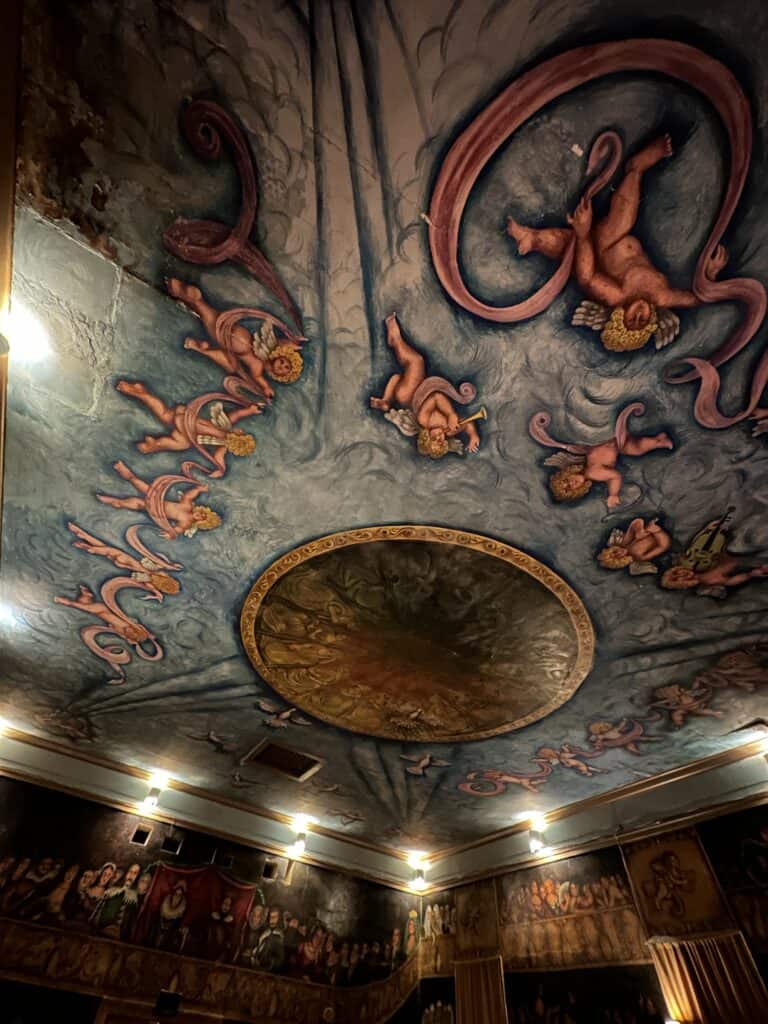close up picture of painted murals on the ceiling of the Amargosa Opera House