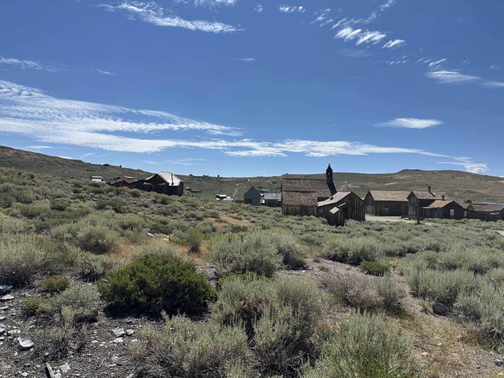 Landscape at Bodie State Historic Park with several buildings under blue skies