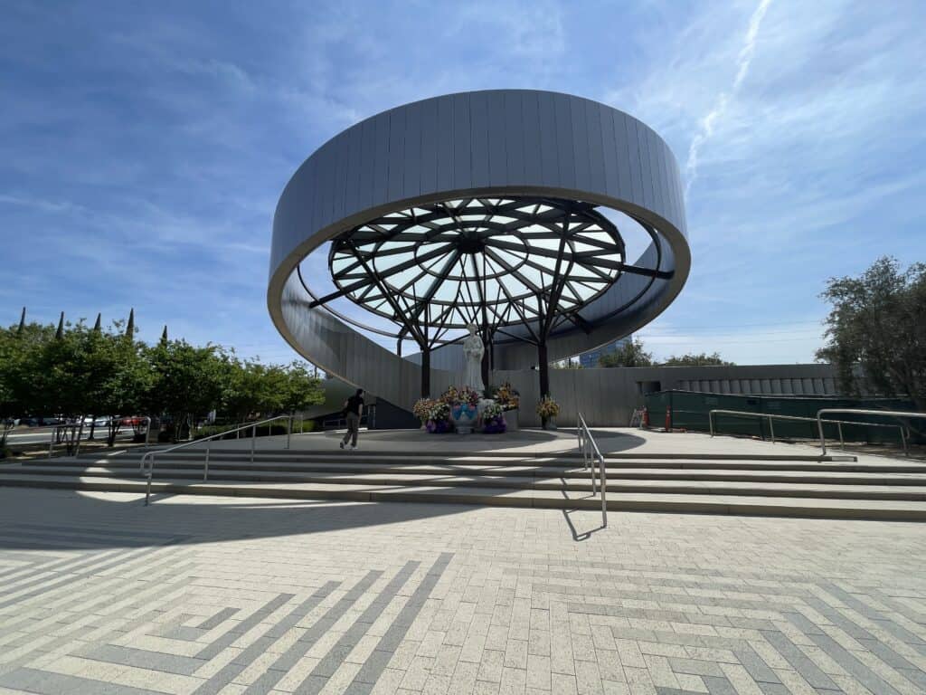 Our Lady of La Vang Shrine at Christ Cathedral in Orange County, featuring a marble statue of the Virgin Mary holding baby Jesus beneath a decorative canopy.