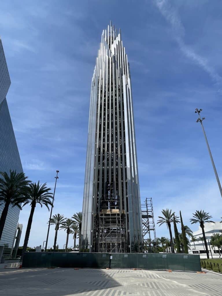 Modern Crean Tower bell tower at Christ Cathedral in Garden Grove, California, featuring suspended bronze bells within its steel framework.