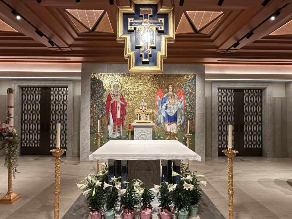 Interior of St. Callistus Chapel beneath Christ Cathedral, showing the main altar and the colorful altar mosaic.